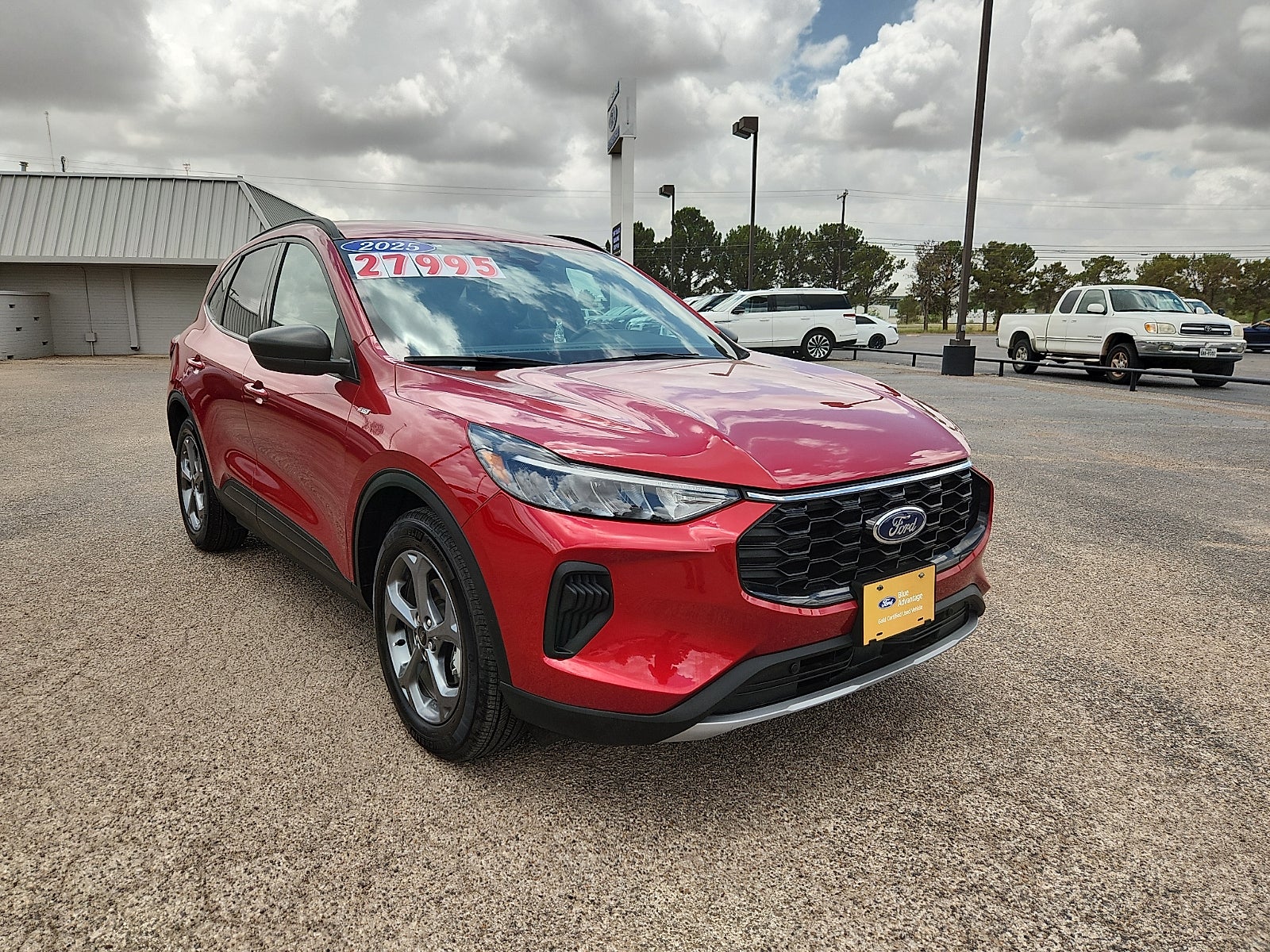 2025 Ford Escape ST-Line in Rapid Red Metallic Tinted Clearcoat — front three-quarter view