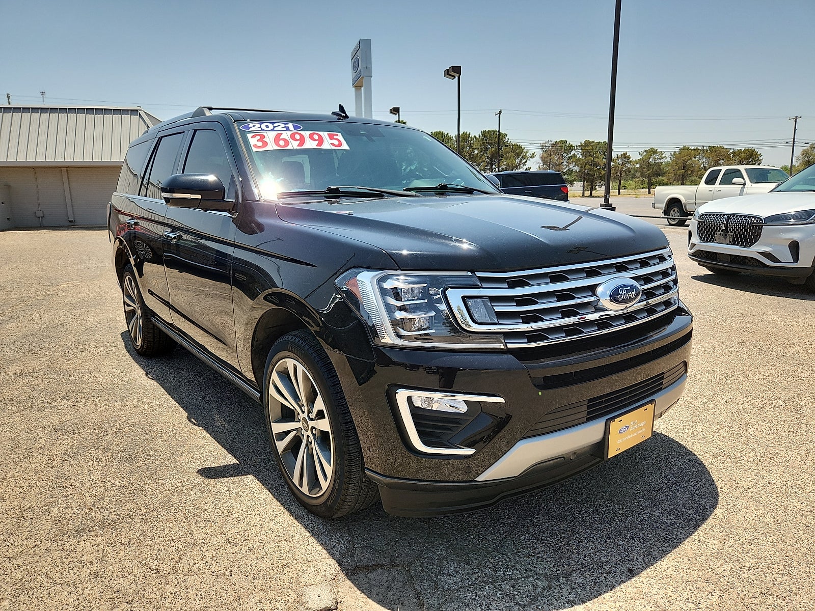 2021 Ford Expedition Limited in Black Metallic — front three-quarter view