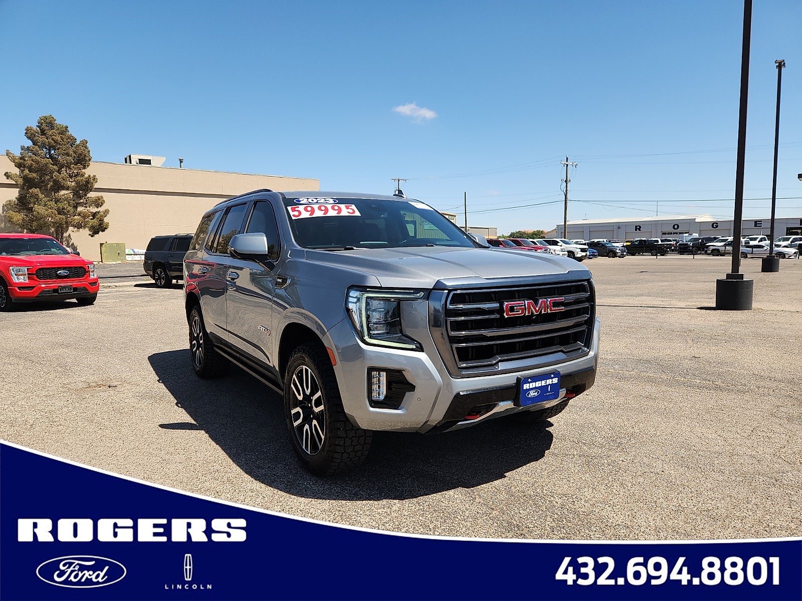 2023 GMC Yukon AT4 in Sterling Metallic — front three-quarter view
